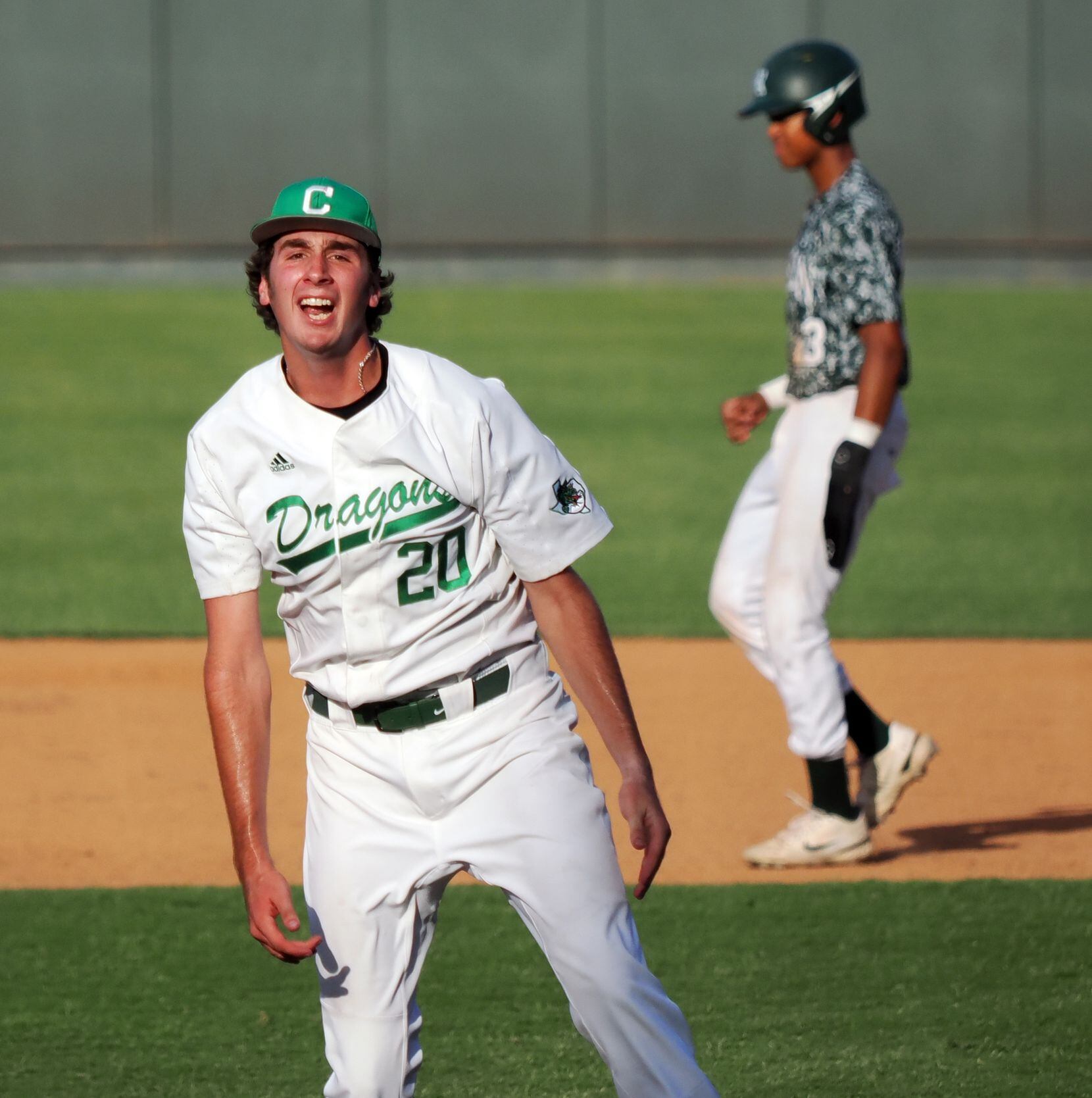 Southlake Carroll relief pitcher Tyler White (20) reacts after throwing the final strike to...