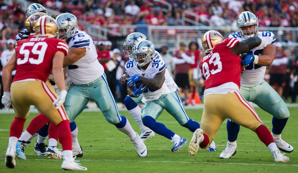 Dallas Cowboys running back Tony Pollard (36) finds a hole during the first quarter of an...