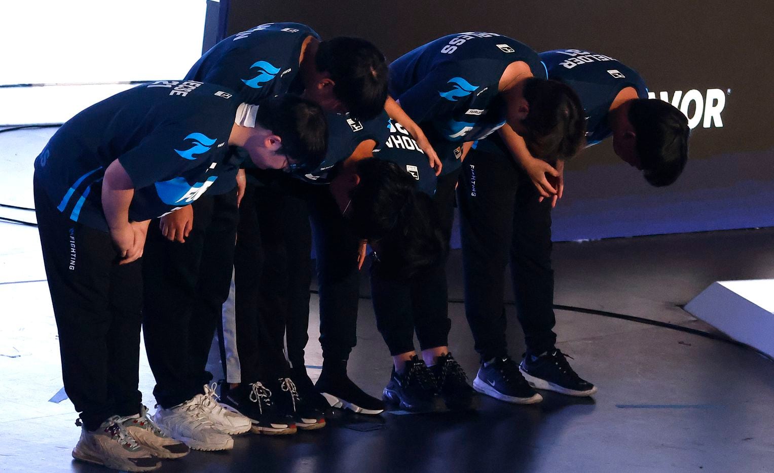 The Dallas Fuel team bows to their fans after defeating the Houston Outlaws in their Overwatch League match at Esports Stadium Arlington Friday, July 9, 2021. The Fuel defeated Houston in The Battle for Texas, 3-0. It was the first in-person live competition for fans in over a year. Houston competed from their hometown. (Tom Fox/The Dallas Morning News)