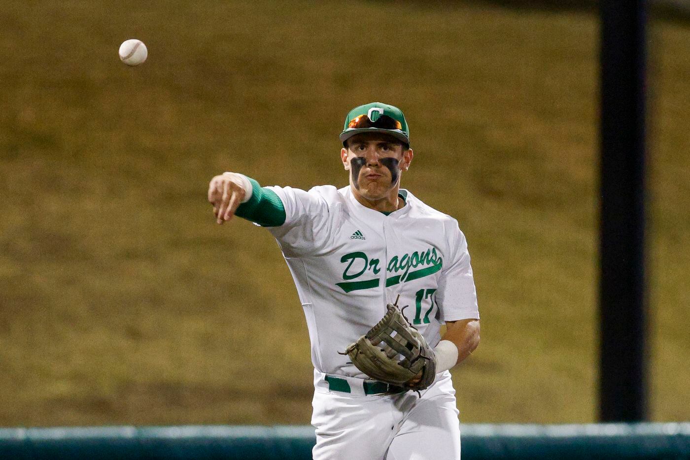 Southlake Carroll third baseman Cole Bedwell (17) throws to first base for an out during the...