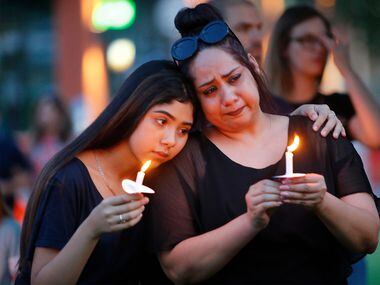 Former El Paso residents Monica Martinez, right, of McKinney and her daughter Tory, 15,...
