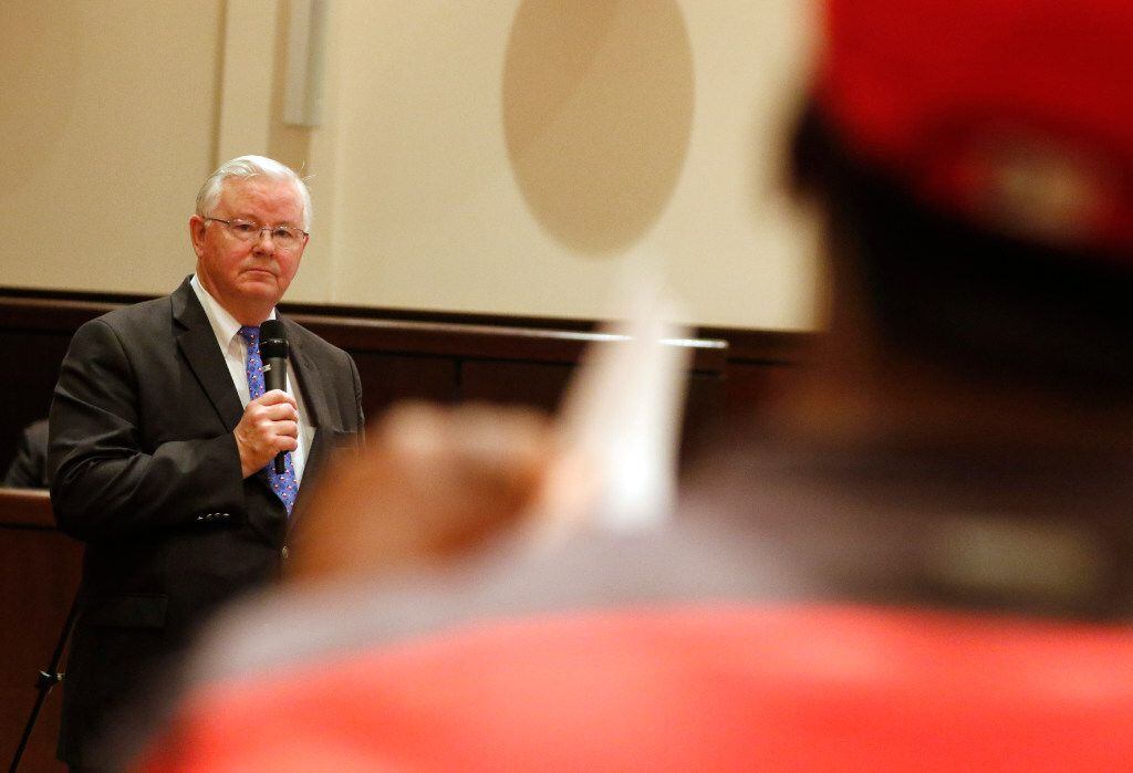 Texas Republican Congressman Joe Barton listens as Chuck Dandridge asks questions during a...
