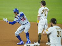 Los Angeles Dodgers right fielder Mookie Betts celebrates after hitting a double as San...