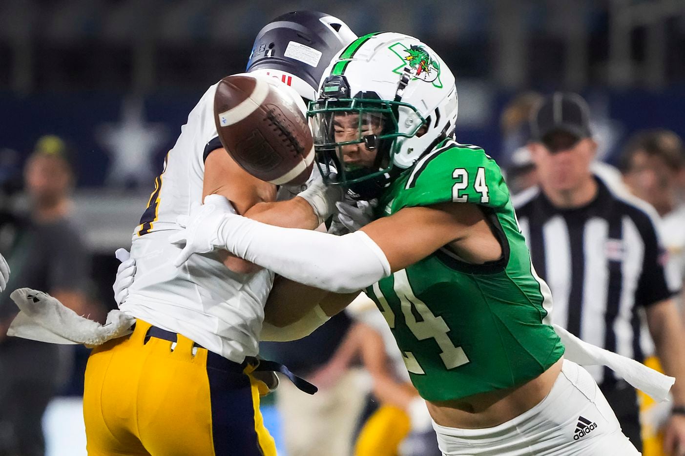 Southlake Carroll defensive back Max Reyes (24) forces a fumble by Highland Park running...