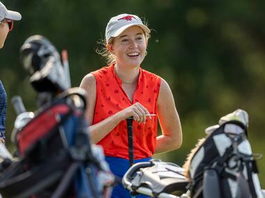 Grapevine’s Audrey Jackson waits to hit from the 11th tee box during the 5A girls state golf...
