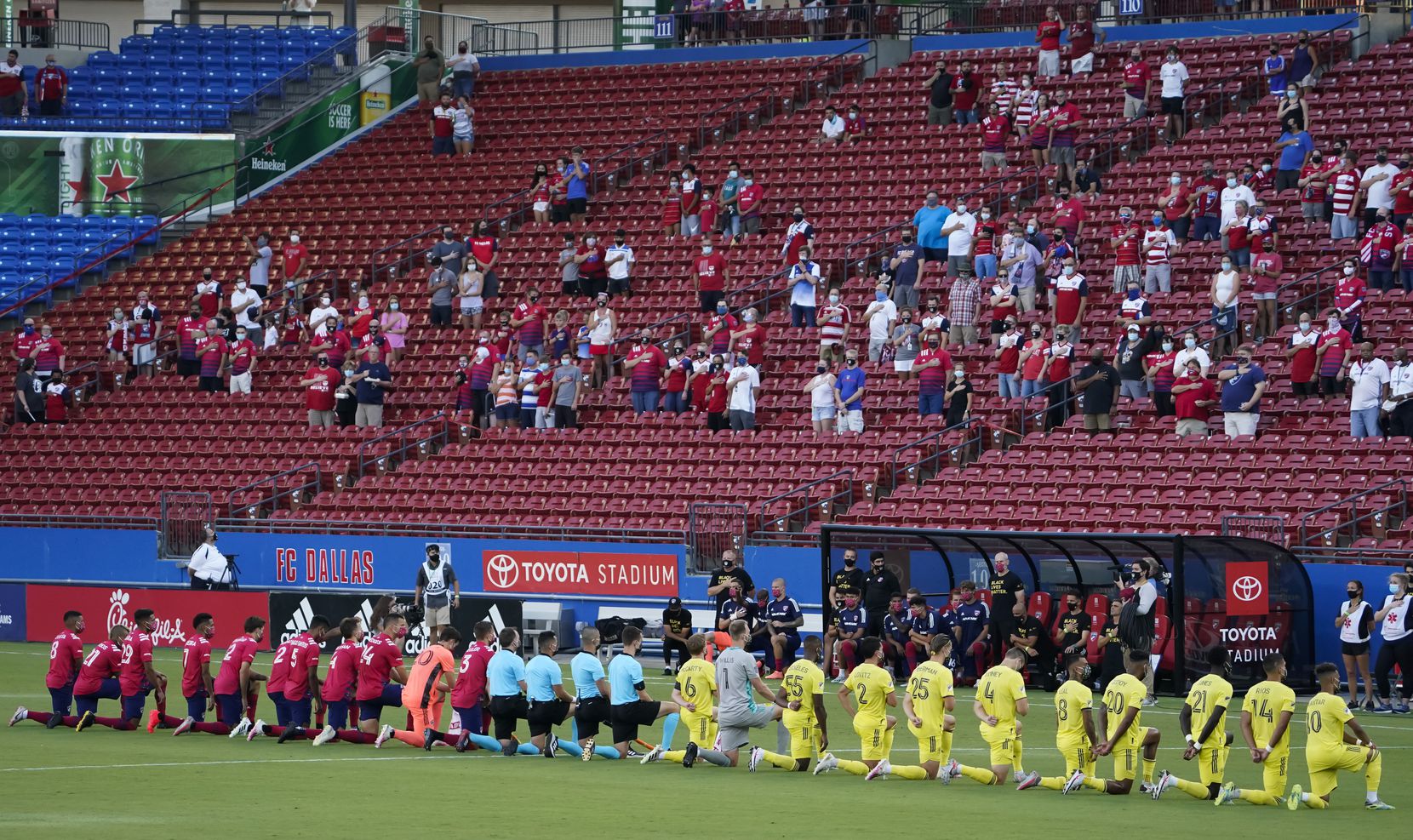 FC Dallas (left) and Nashville SC players kneel during the national anthem before an MLS soccer game at Toyota Stadium on Wednesday, Aug. 12, 2020, in Frisco, Texas. (Smiley N. Pool/The Dallas Morning News)