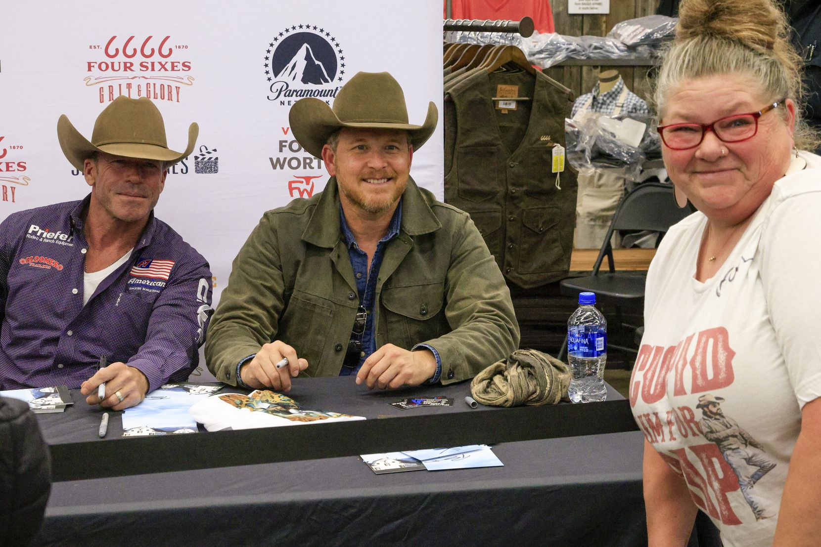 “Yellowstone” fan Sherry Bryant poses for a photo with show creator Taylor Sheridan (left)...