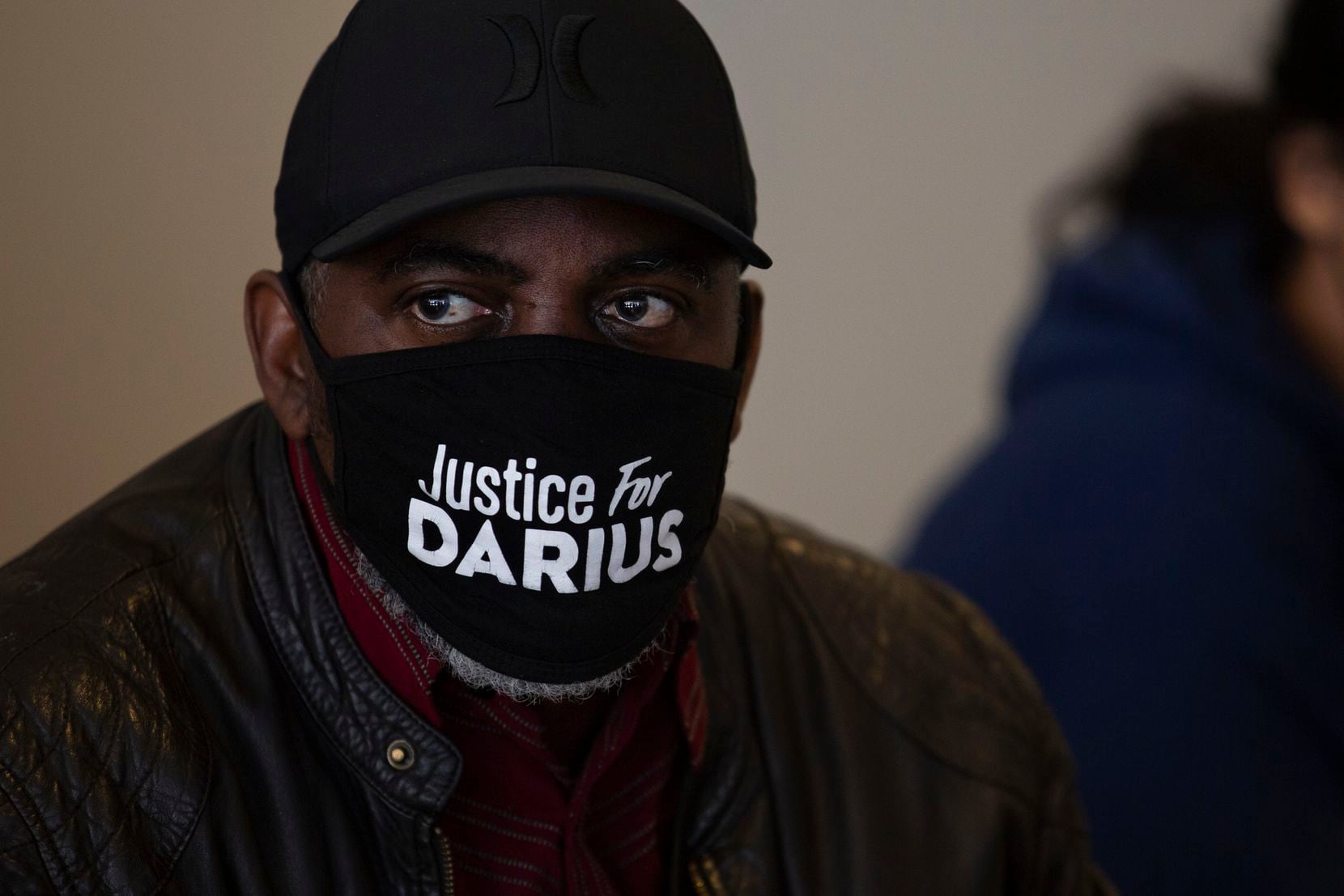 Kevin Tarver, father of Darius Tarver who was shot by police officers in Denton January 21, 2020, listens to attorney Lee Merritt speak at the Collin County SheriffÕs Office in McKinney, TX on Friday, March 19, 2021. Family and friends of Marvin Scott III, who died in while in custody on Sunday, March 14, 2020 were not allowed into the press conference over the incident held by Collin County Sheriff Jim Skinner. (Shelby Tauber/Special Contributor)