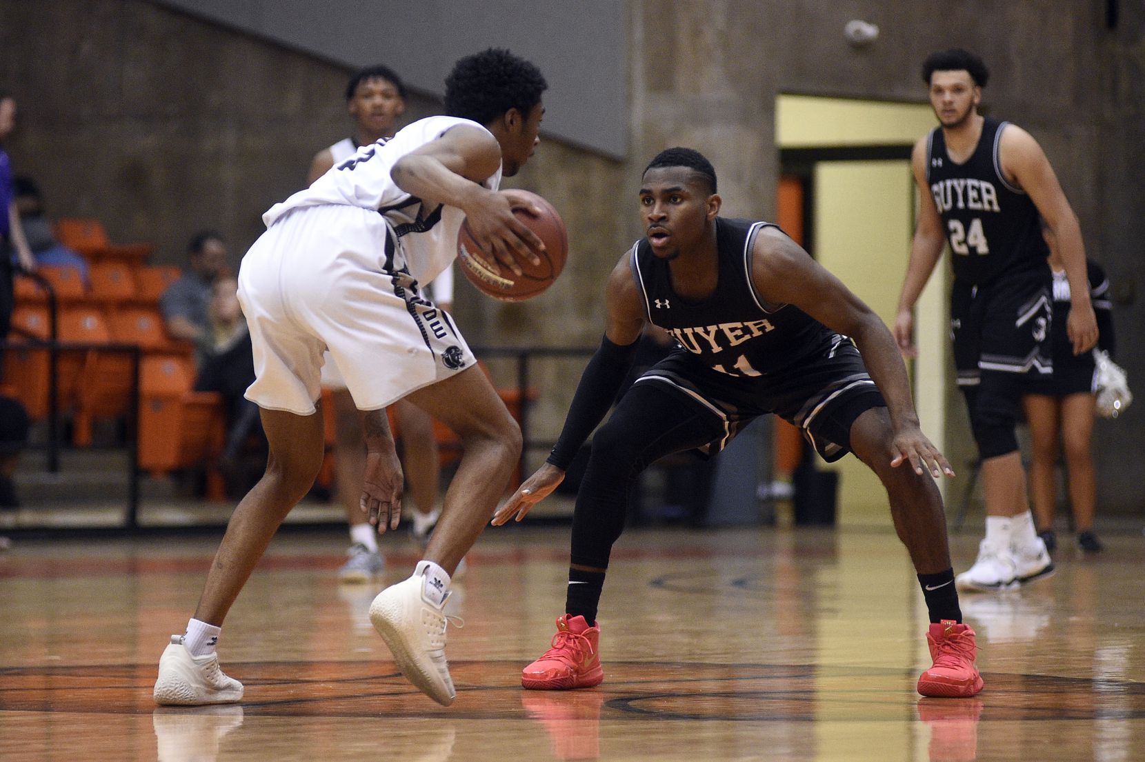 Denton Guyer senior guard De'Vion Harmon (11) defends against Odessia Permian players during the game at the Wilkerson-Greines Athletic Center in Fort Worth, Texas on Friday, March 1.