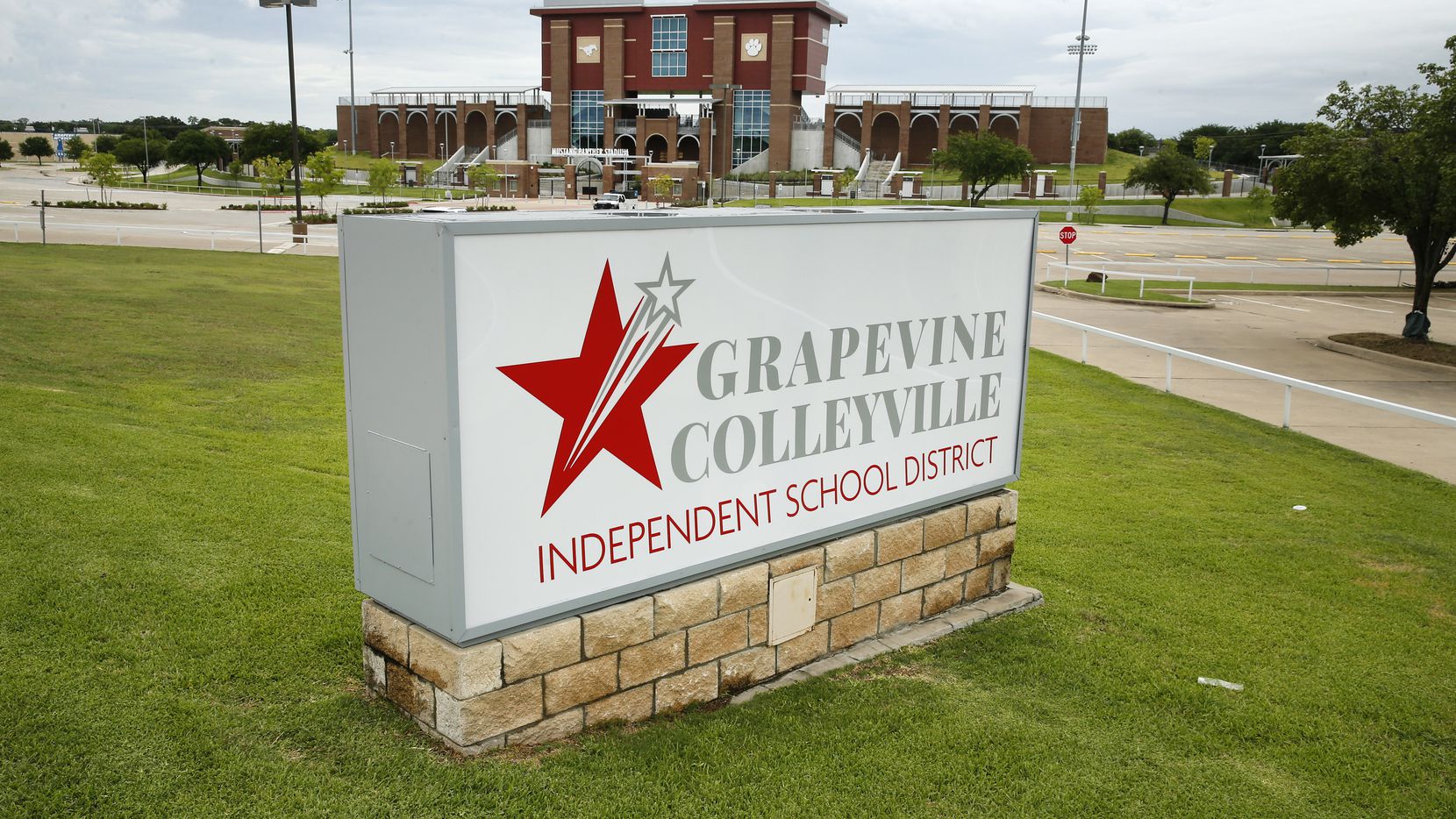 The Grapevine-Colleyville  ISD sign is pictured before Mustang Panther Stadium in Grapevine,...