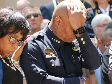 Dallas Police Chief David Brown pauses at a prayer vigil during a citywide prayer service in...