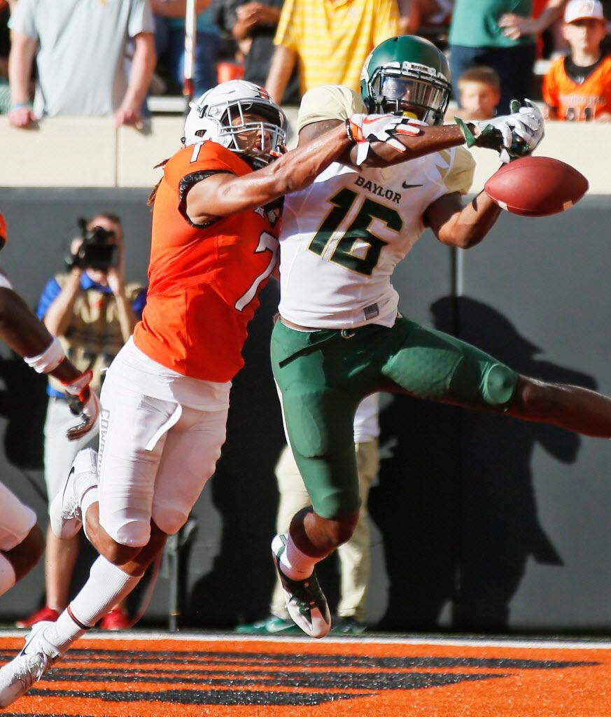 Oklahoma State safety Ramon Richards (7) breaks up a pass intended for Baylor wide receiver Jared Atkinson (16) in the second half of an NCAA college football game in Stillwater, Okla., Saturday, Oct. 14, 2017. Oklahoma State won 59-16. (AP Photo/Sue Ogrocki)