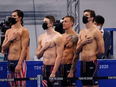 USA’s Michael Andrew,  Ryan Murphy, Caeleb Dressel, and Zach Apple of the men’s 4x100 meter...