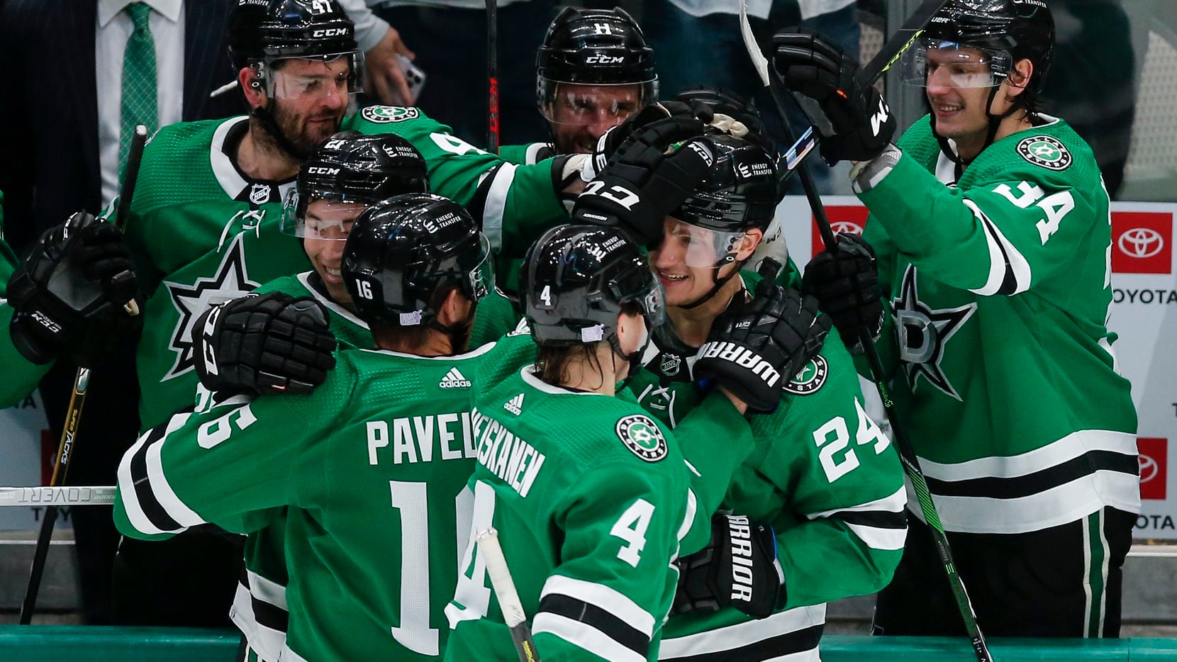Dallas Stars forward Roope Hintz (24) is congratulated by teammates after scoring an empty net goal, for the hat trick, during the third period of an NHL hockey game against the Carolina Hurricanes in Dallas, Tuesday, November 30, 2021. Dallas won 4-1.