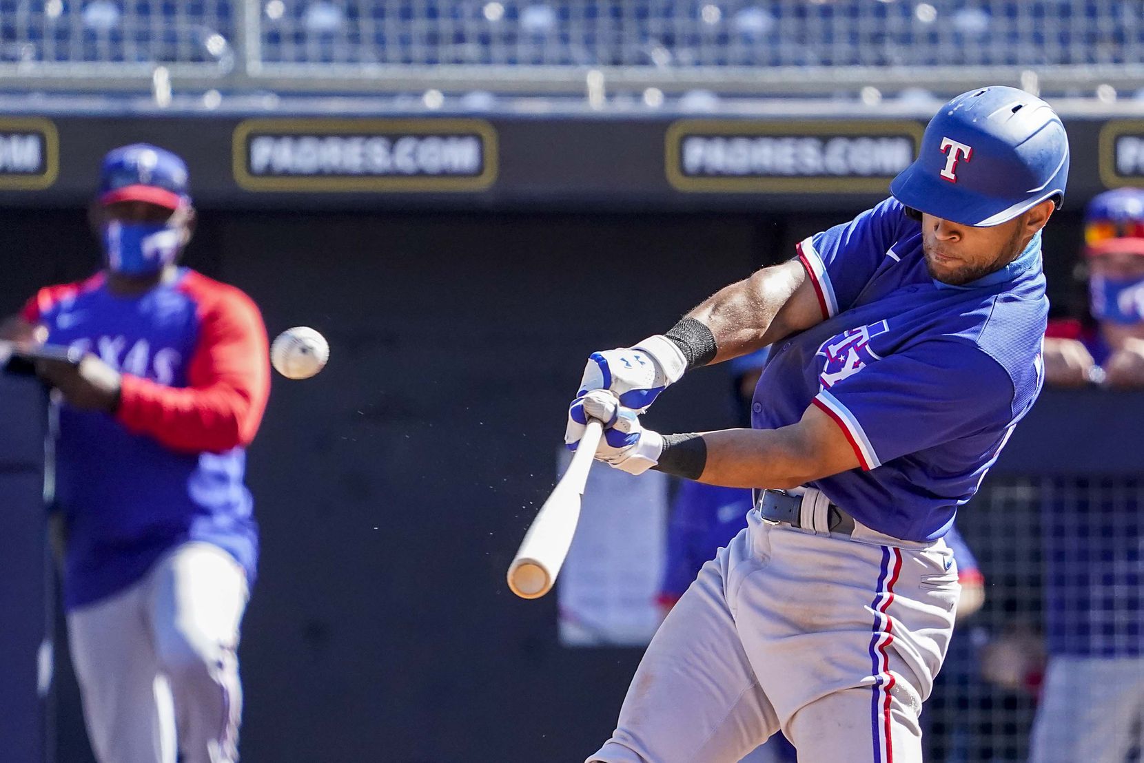 Texas Rangers outfielder Jason Martin hits a solo home run during the fifth inning of a spring training game against the Seattle Mariners at Peoria Sports Complex on Wednesday, March 10, 2021, in Peoria, Ariz.