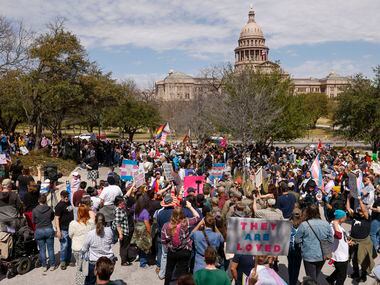 Demonstrators gather near the Texas State Capitol during the "Trans Kids Cry For Help" rally...