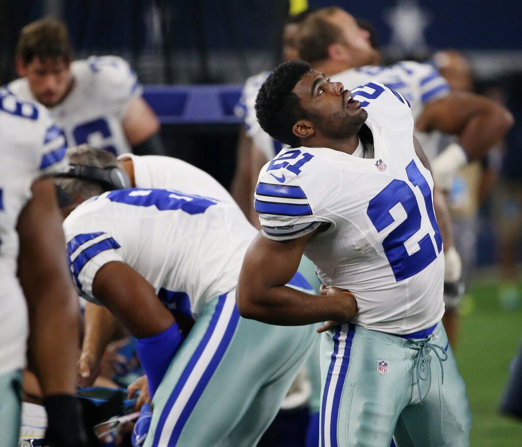 Dallas Cowboys running back Ezekiel Elliott (21) stretches in the fourth quarter during a...