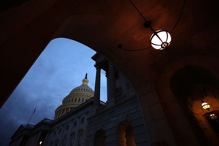 The U.S. Capitol is shown at sunset October 15, 2013 in Washington, DC. during a government...