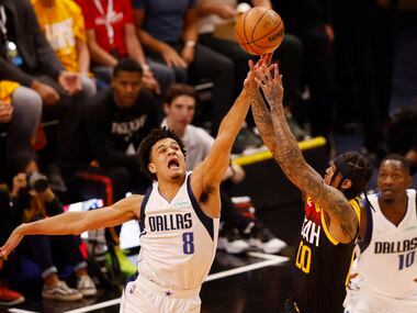 Dallas Mavericks guard Josh Green (8) defends a shot attempt from Utah Jazz guard Jordan...