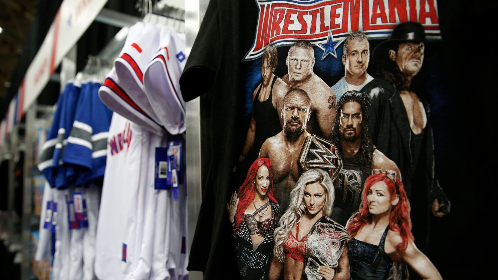 WWE merchandise on display for WrestleMania Axxess at the Kay Bailey Hutchison Convention...