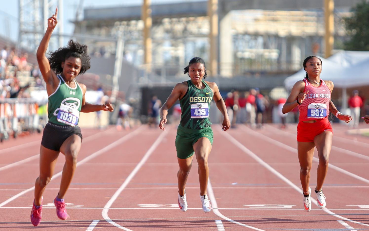 DeSoto's Ja'Era Griffin (center) places fifth during her 6A Girls 100 meter run at the UIL state track meet at the Mike A. Myers Stadium, at the University of Texas on May 8, 2021 in Austin, Texas. Jasmine Montgomery of San Antonio Reagan (left) won first place.