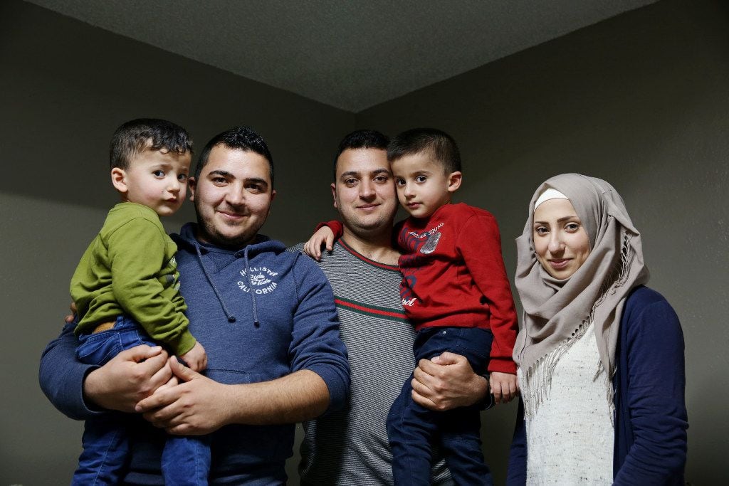 Syrian refugees Moustafa Jawish (center), his wife Reem Khero and their children, Khalil...