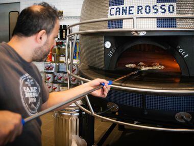 Order a pizza and a pizzaiolo will pull it out of Dallas Cowboys helmet-shaped oven at Cane Rosso in Frisco.
