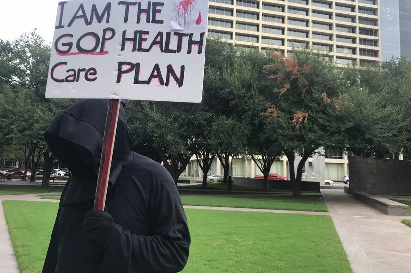 Cary Clark of Fort Worth dressed as the grim reaper for a protest opposing Texas' attempts...
