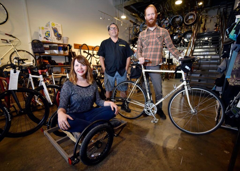 Kristie Holt, co-owner of Local Hub Bicycle Co., service manager John Kendall and Mark Draz,...