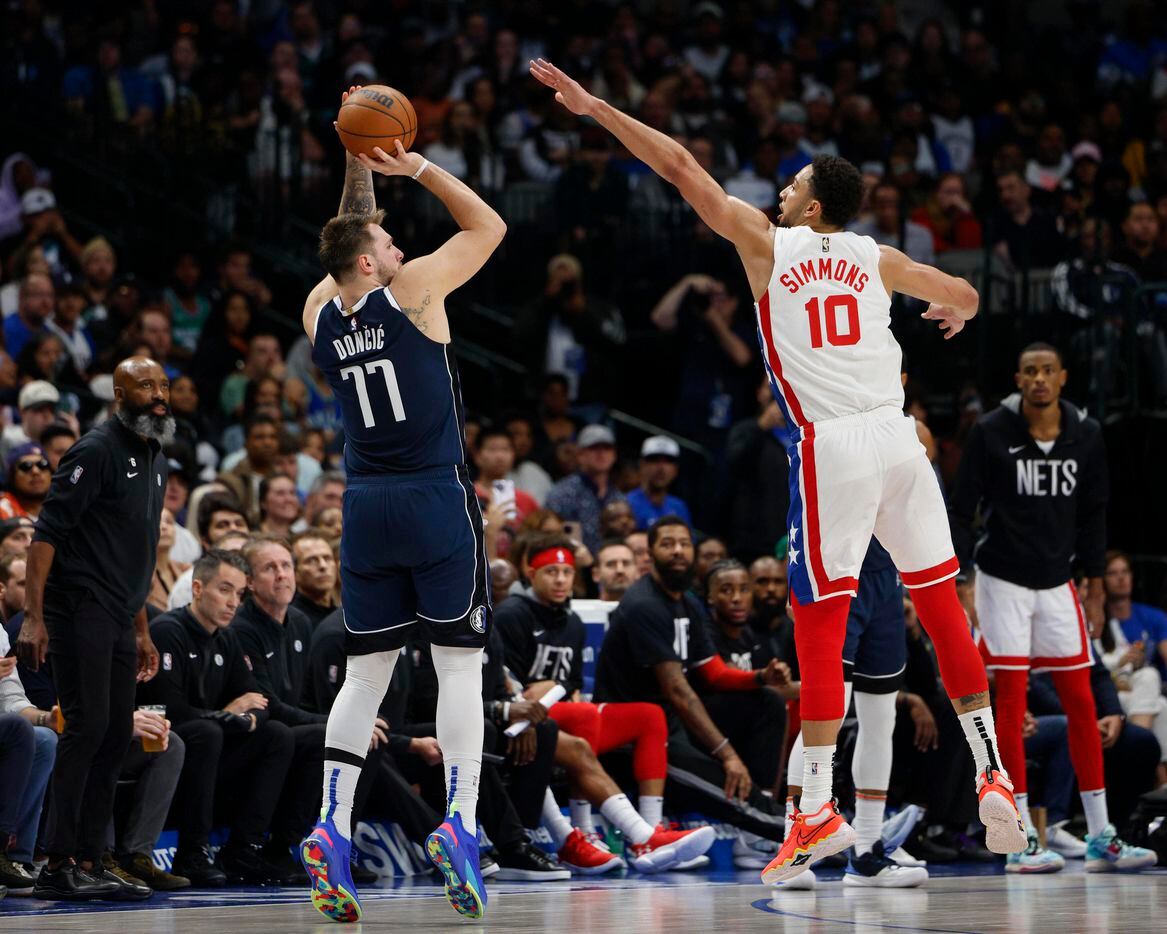 Dallas Mavericks guard Luka Doncic (77) shoots over Brooklyn Nets guard Ben Simmons (10)...