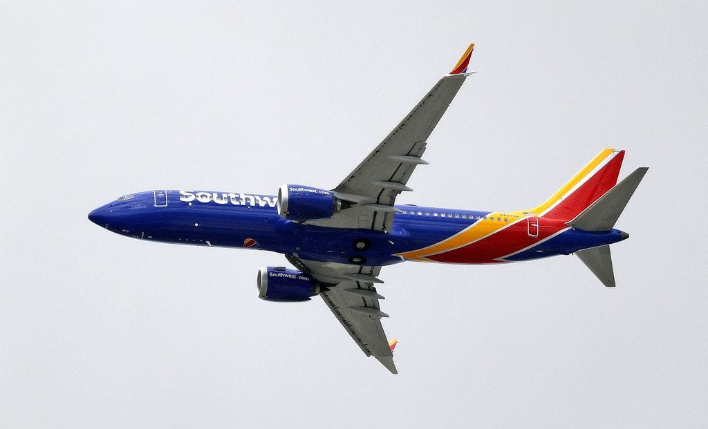 A Southwest Airlines Boeing 737 MAX 8 jet flies over Mesa, Ariz., en route to Phoenix's Sky Harbor International Airport Wednesday afternoon, March 13, 2019. 
