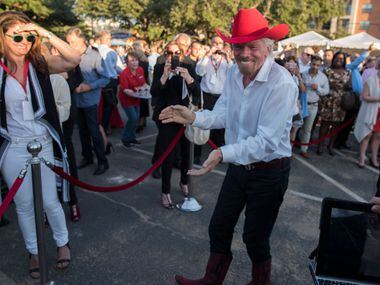 Richard Branson dances to country music after the ground breaking for his Virgin Hotel in...