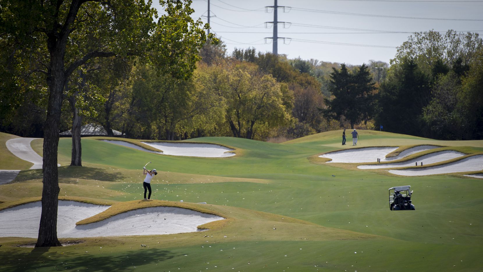 Michelle Hahm of Coppell hits for the green at Cowboys Golf Club in Grapevine, which is...