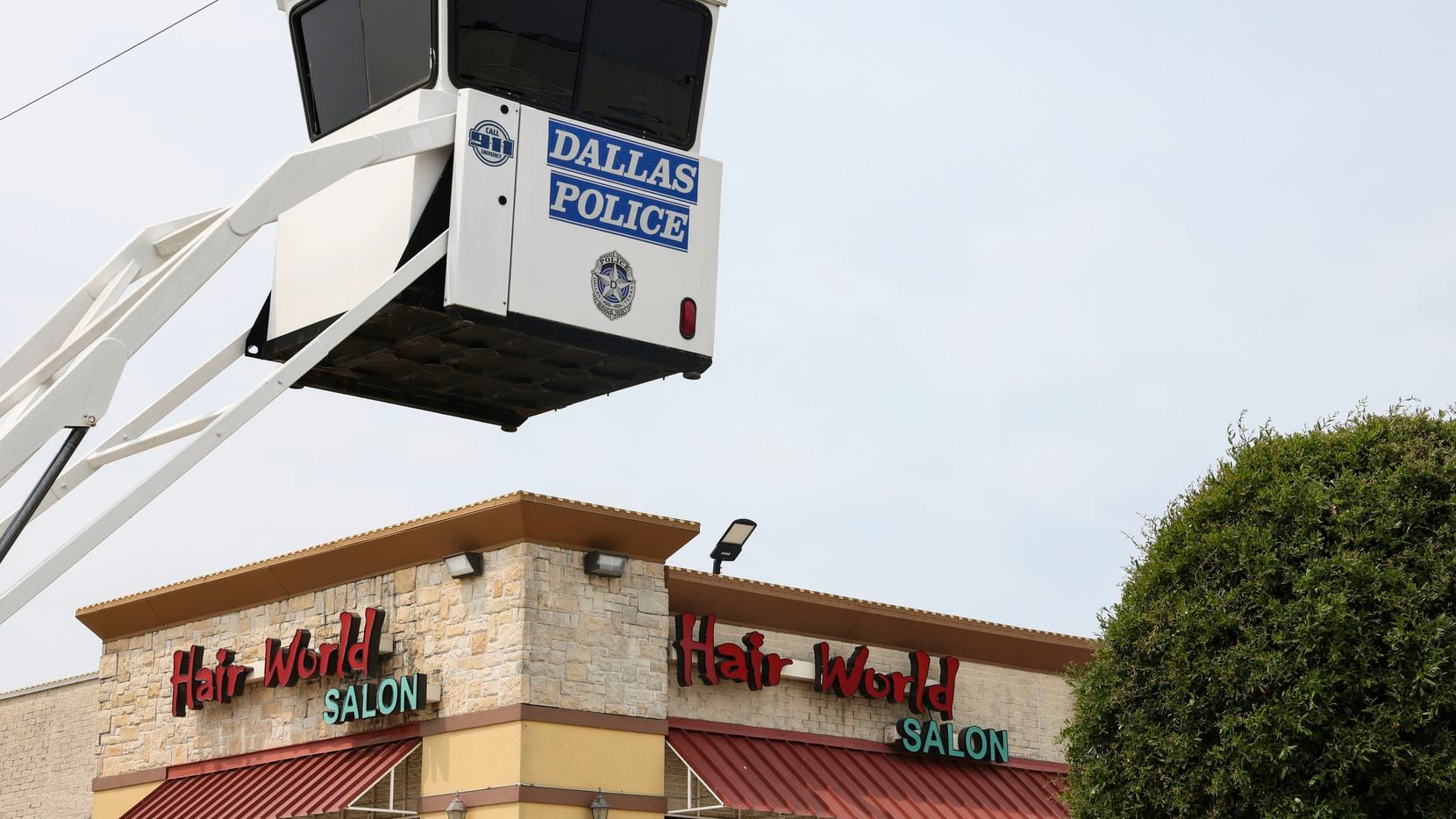 A Dallas police surveillance stand overlooked the parking lot at Hair World Salon in Dallas...