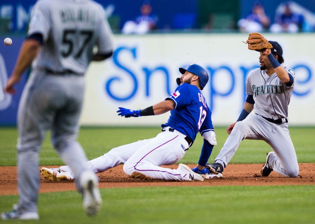 Texas Rangers center fielder Joey Gallo (13) is safe with a double after Seattle Mariners...