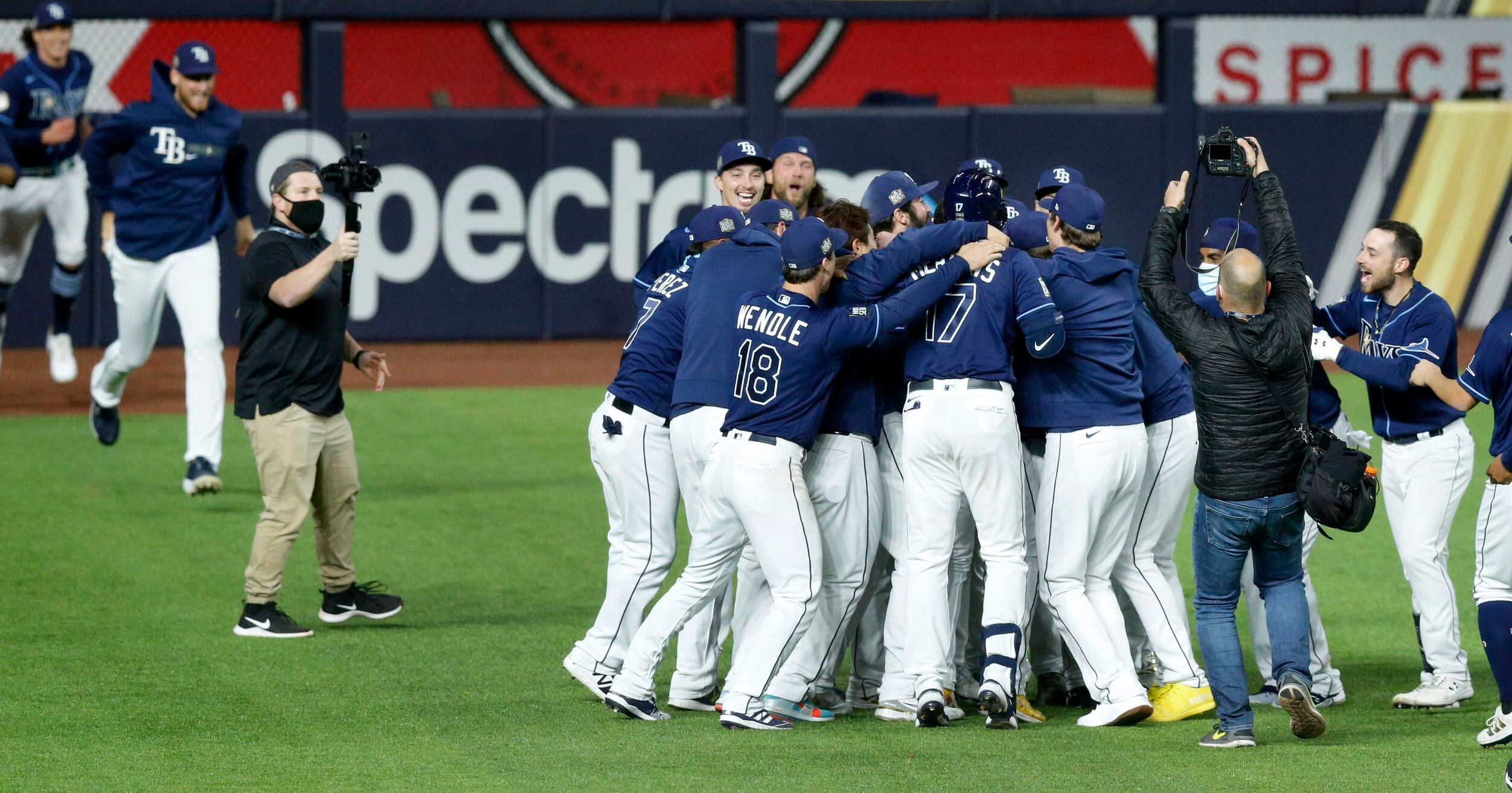 Photos: Randy Arozarena lays on home plate after game-winning run