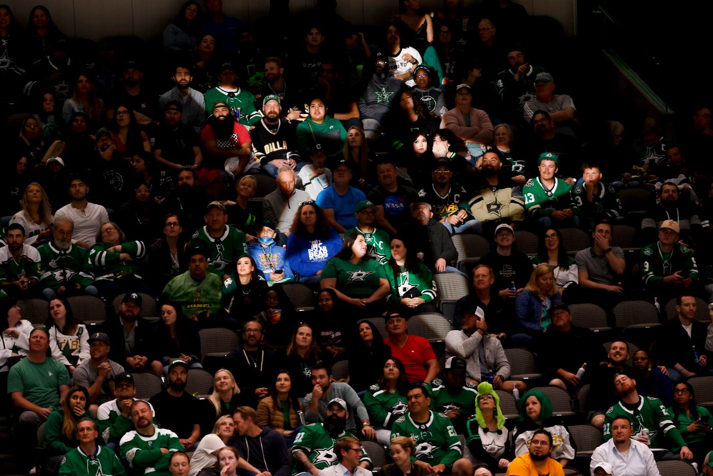 Dallas Stars fans watch before the second period of a game against the Arizona Coyotes, on...