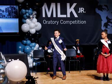 Fifth grader Tristan Whitfield of Paul L. Dunbar Learning Center reacts to winning the 30th...