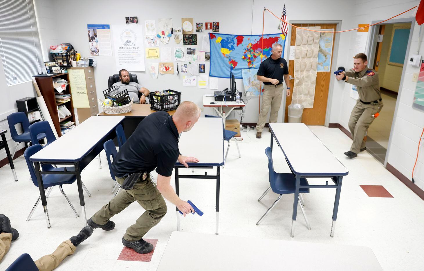 Texas DPS Trooper Chuck Pryor (right) engages an active shooter portrayed by Athens Police...