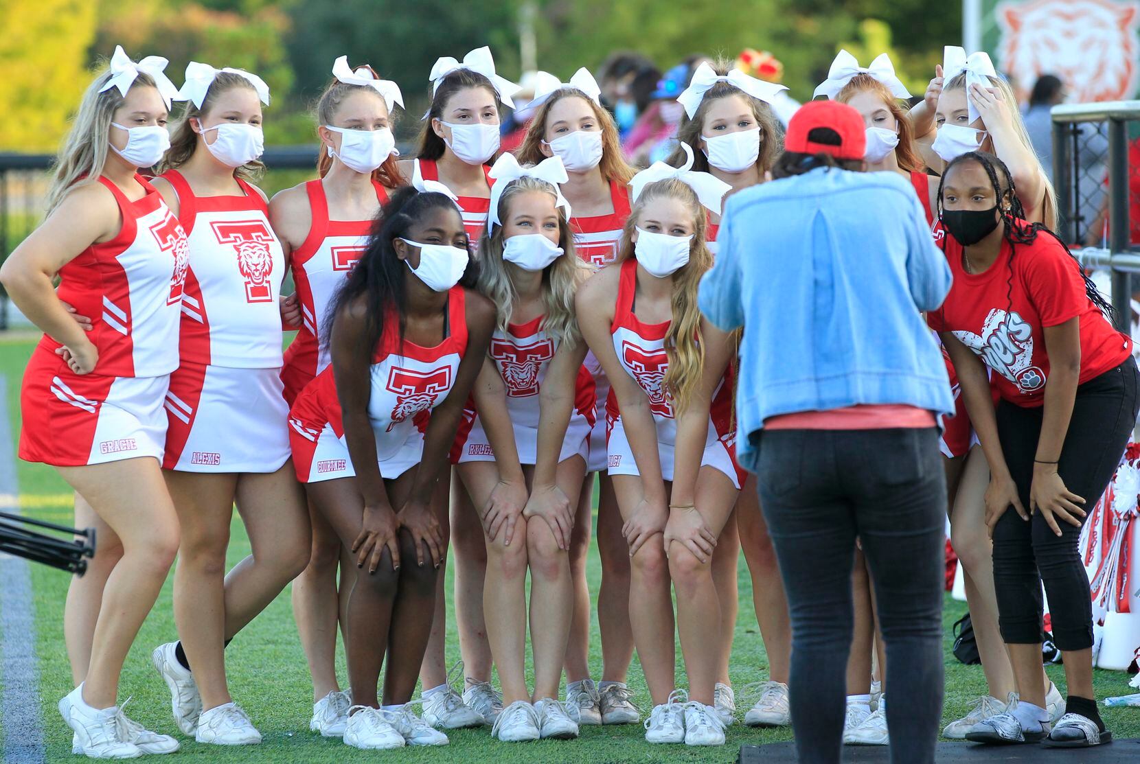 The Terrell cheerleaders have their picture taken in masks before the first half of between...