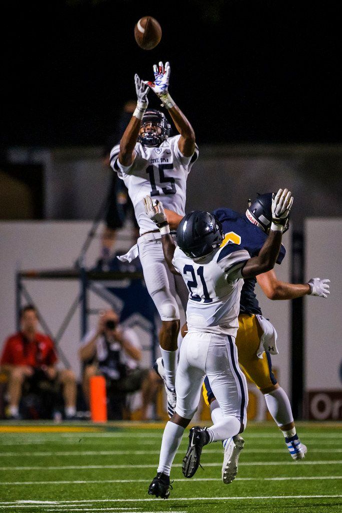 Frisco Lone Star safety Toren Pittman (15) leaps to make an interception on a pass intended...