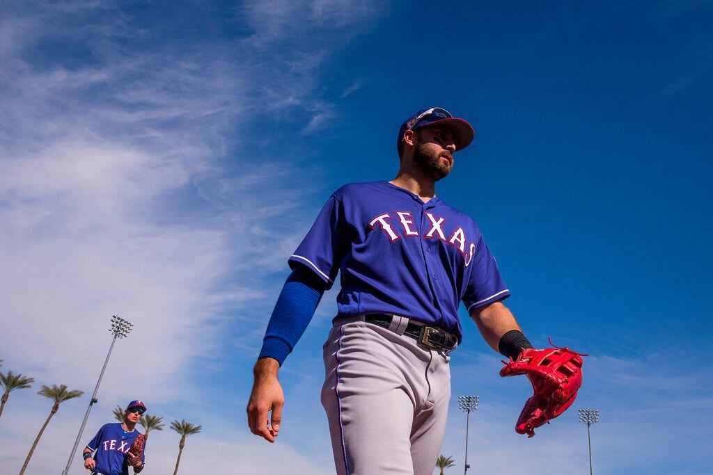 Texas Rangers outfielder Joey Gallo heads for the dugout during the fifth inning of a spring...