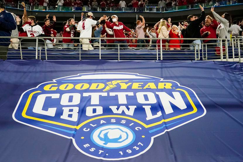 Oklahoma fans celebrate a Sooners touchdown during the first half of the Cotton Bowl Classic...