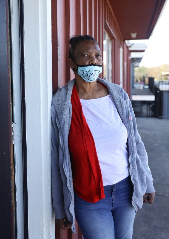 Patricia Freeman poses by the door of her new apartment in southern Dallas on November 19, 2021. Freeman got help getting her new home through the Dallas Rapid Rehousing program. (Liesbeth Powers/Special Contributor)