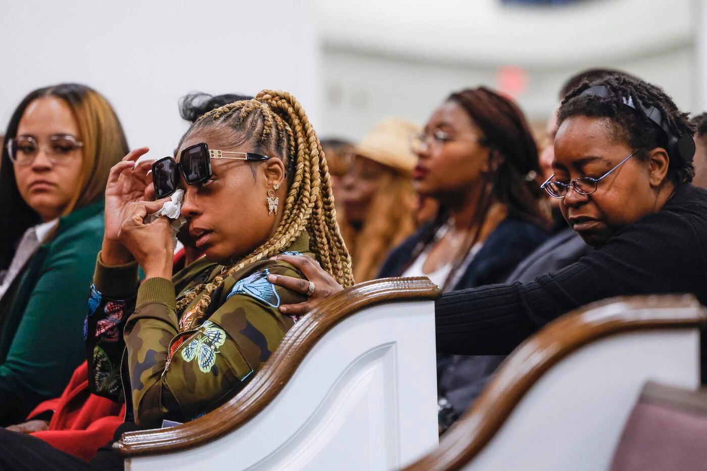 LaTanya Reese (left) grandmother of late Legend Chappell, gets emotional about bidding...