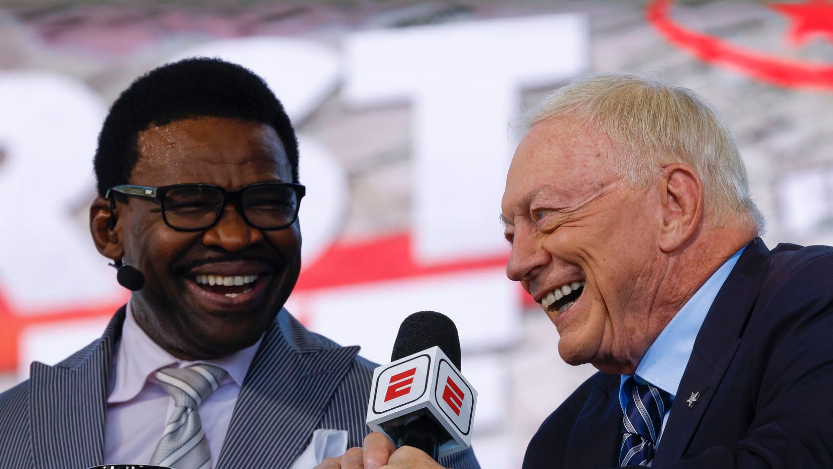 Former Dallas Cowboys player Michael Irvin, left, and Cowboys owner Jerry Jones laughs...