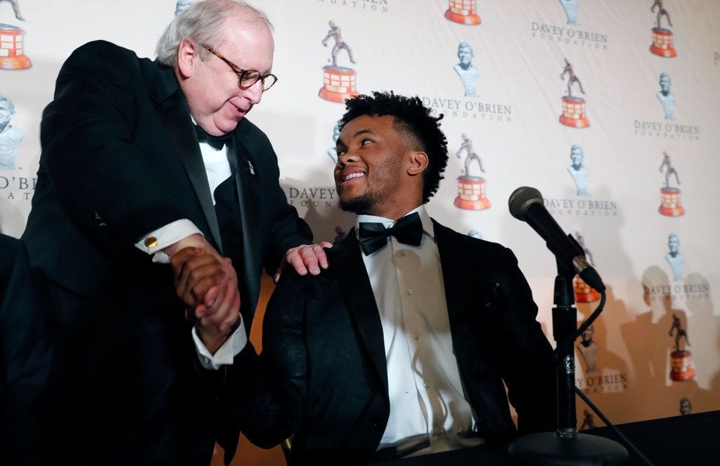 Oklahoma quarterback Kyler Murray, right, shakes hands with David O'Brien Jr. after a news conference at the Davey O'Brien Awards dinner in Fort Worth.. (AP Photo/LM Otero)