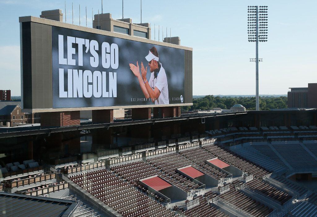 The scoreboard at the Oklahoma football field reads "Let's Go Lincoln" following a news...