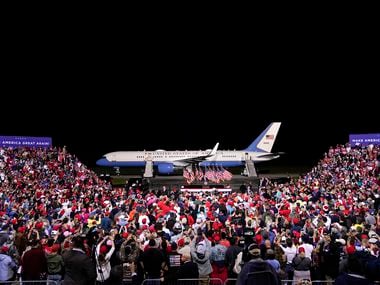 With Air Force One behind him, President Donald Trump campaigns at a rally that drew thousands of supporters to Newport News/Williamsburg International Airport on Sept. 25, 2020 in Newport News, Va.