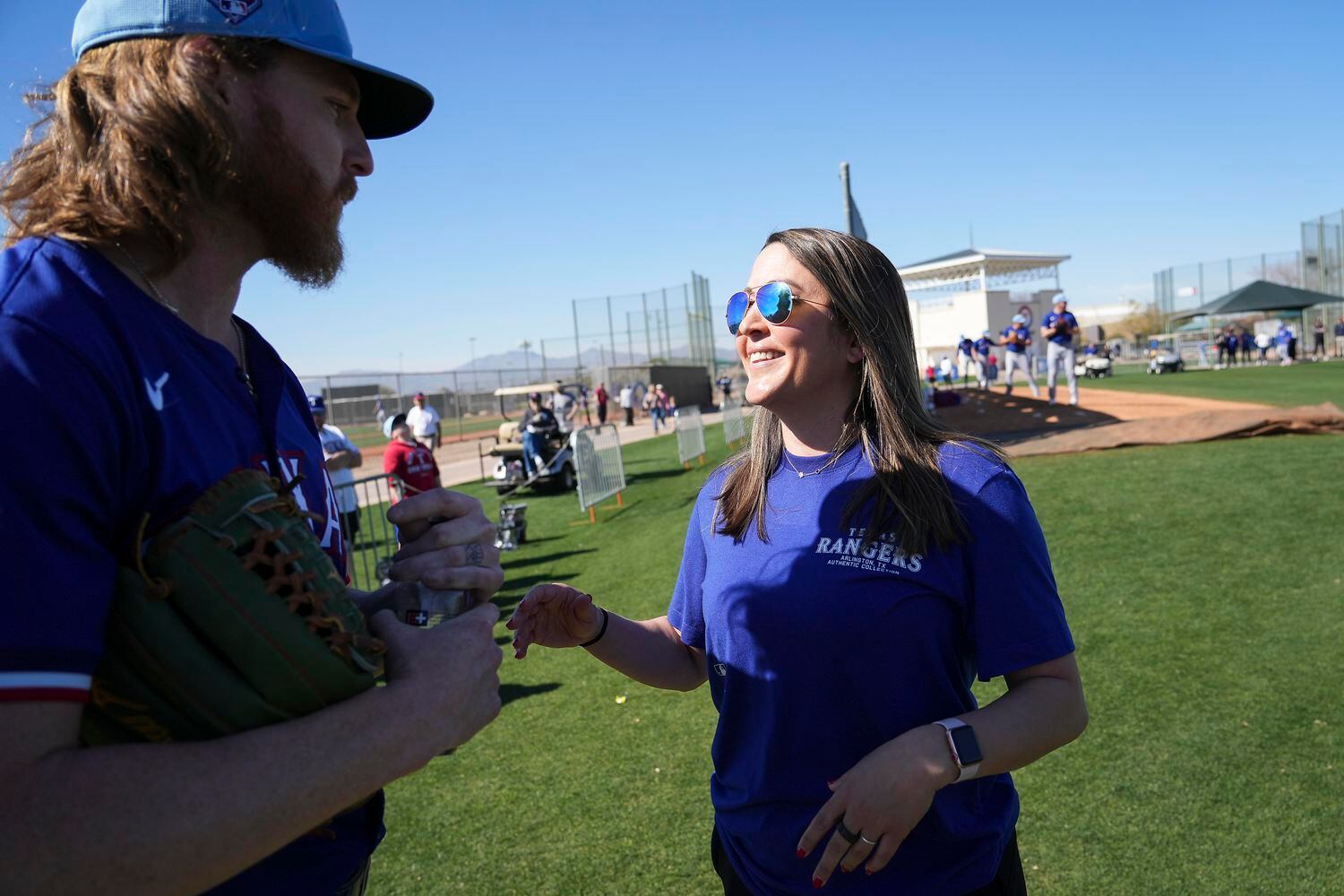 Texas Rangers dietitian Katie McInnis talks with pitcher Jon Gray during a spring training...